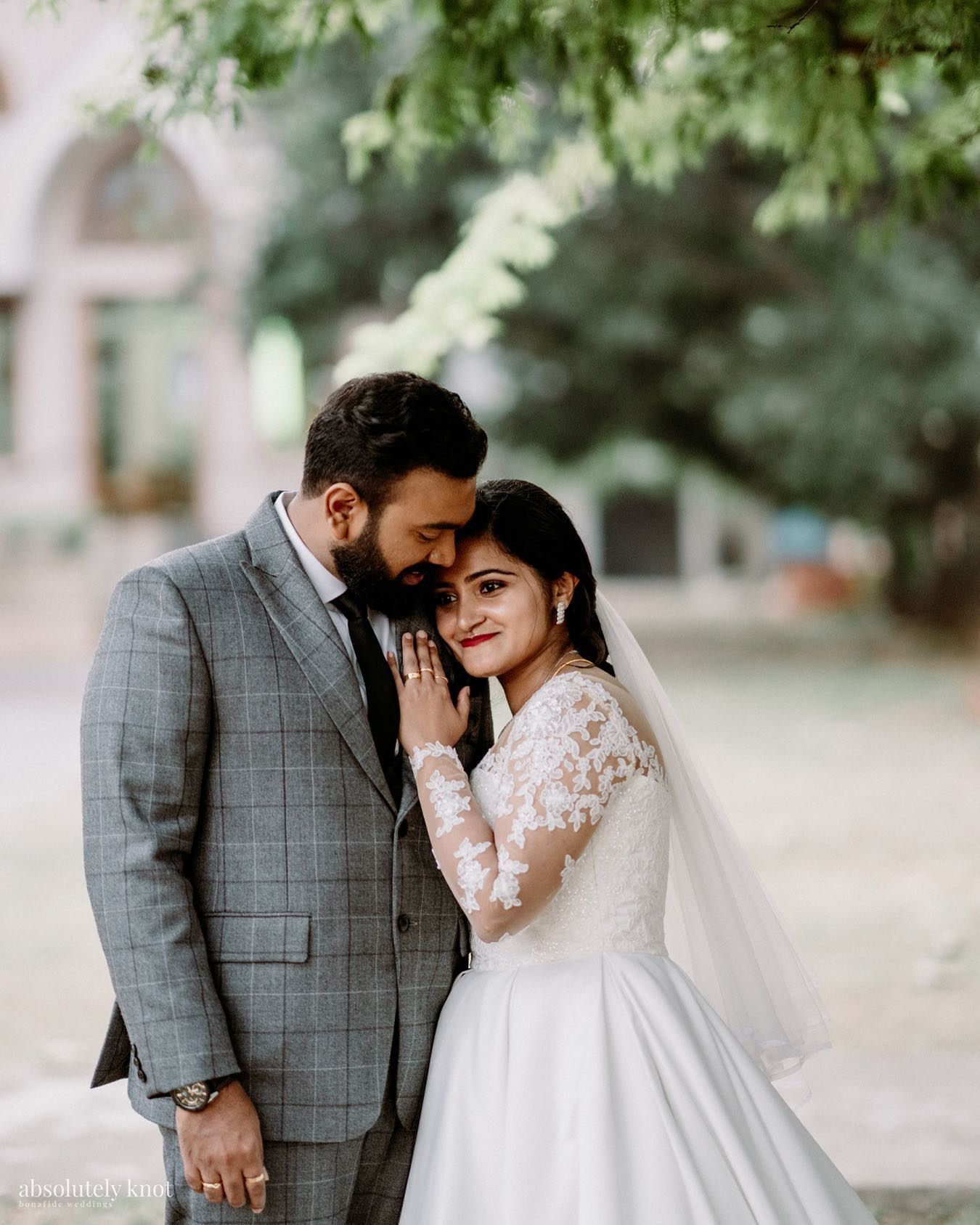 A bride and groom embracing outside a church